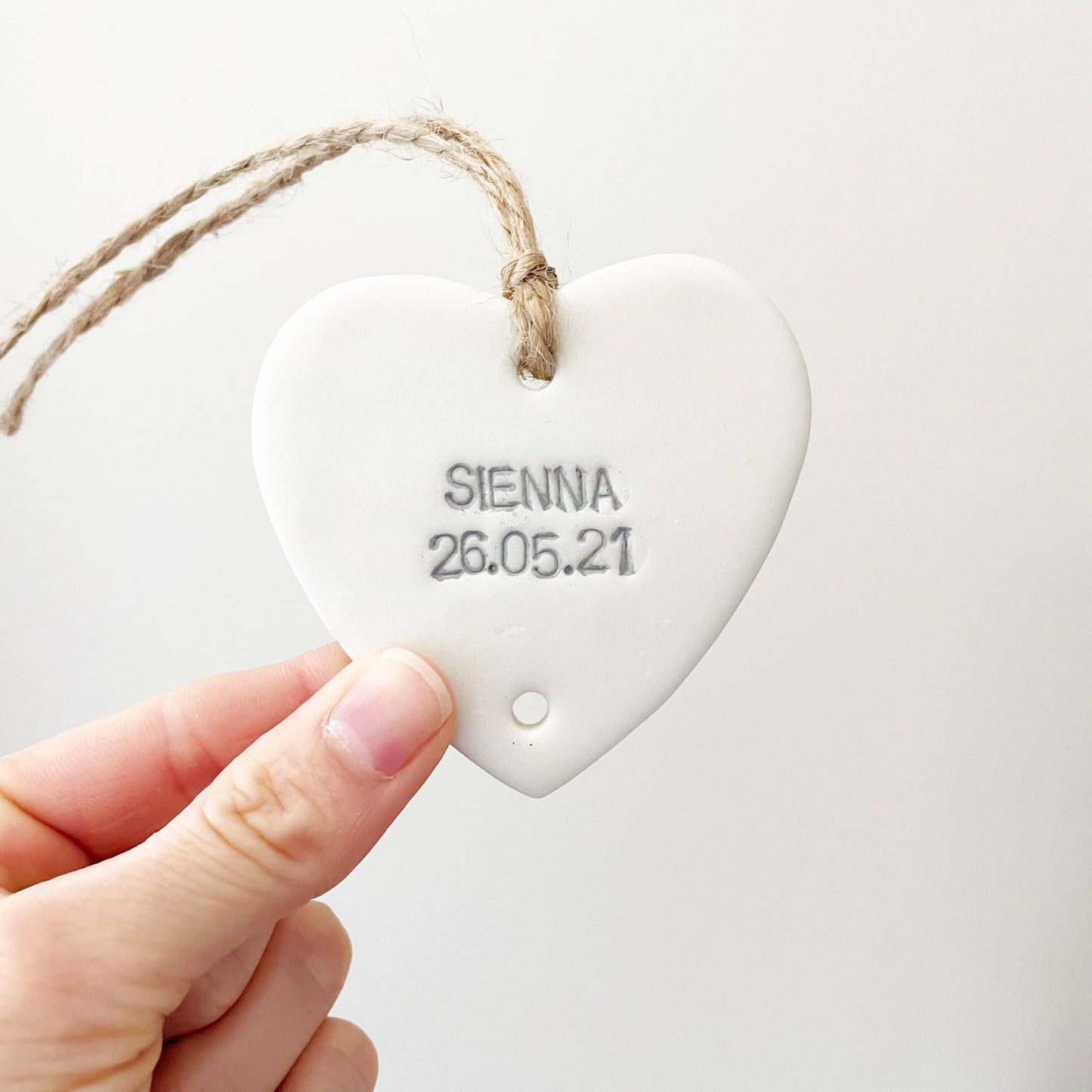 Small pearlised white polymer clay heart personalised with a name and date of birth, grandchild keepsake add on heart