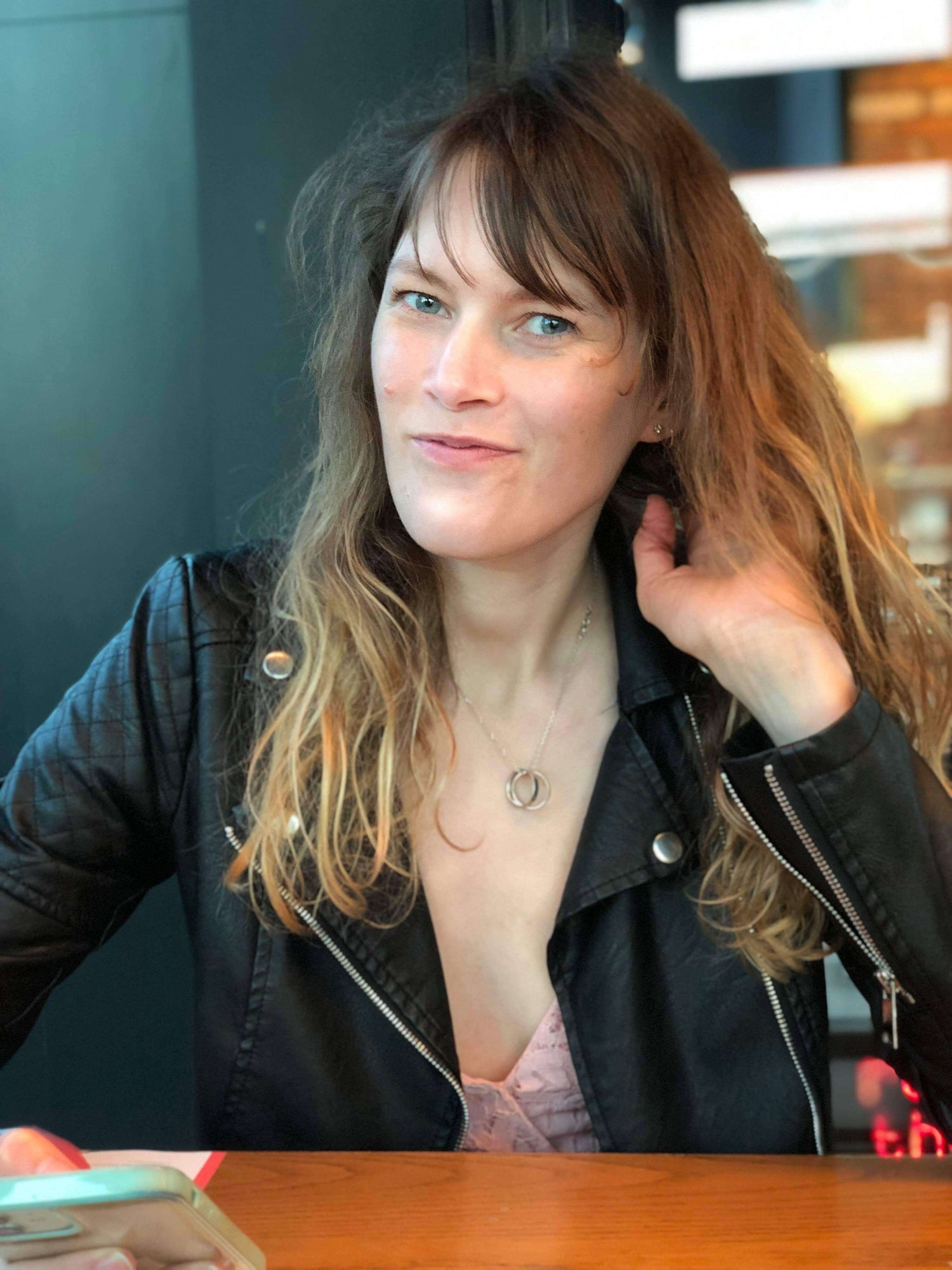 Kirsty Rossington smiling and playing with her hair