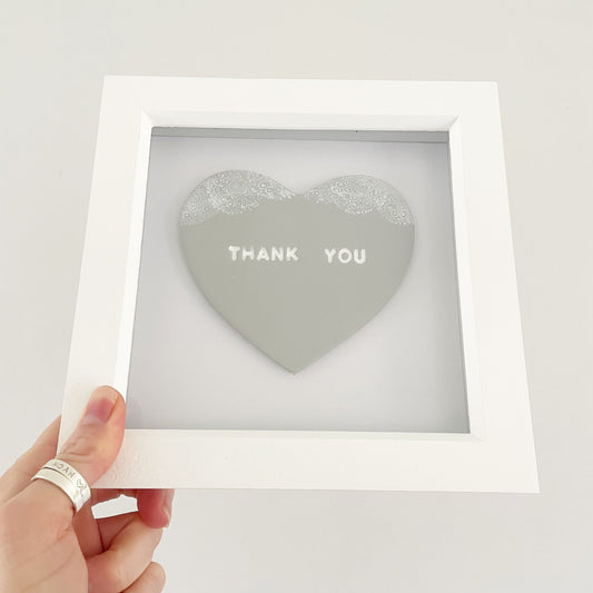 Personalised framed thank you gift, grey clay heart with a white lace edge top, in a white box frame, the heart is personalised with THANK YOU