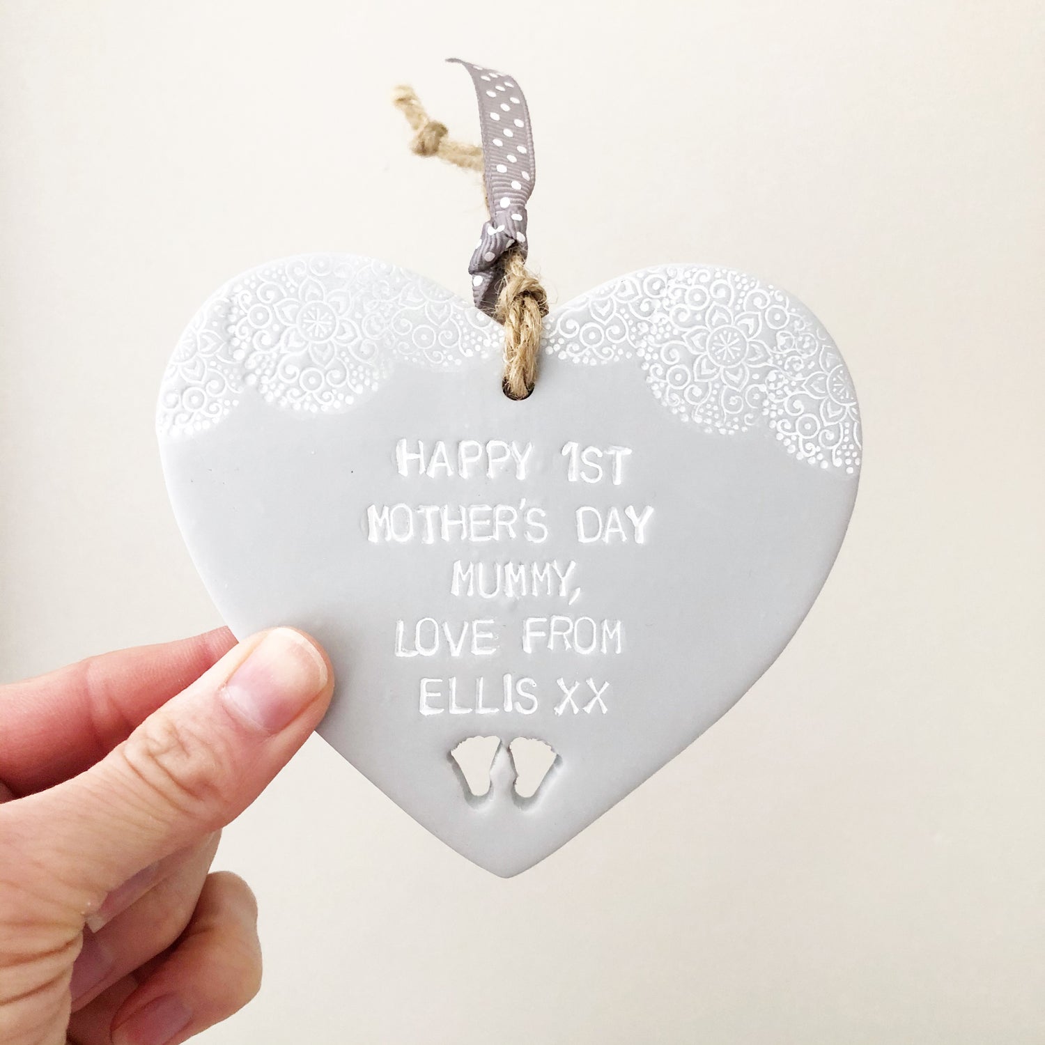 Pearlised white clay heart personalised with HAPPY 1ST MOTHER’S DAY MUMMY, LOVE YOU FOREVER AND ALWAYS, STEVIE XXX with baby feet cut out at the bottom