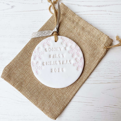 Personalised baby’s first Christmas bauble ornament, glitter white round clay with SONNY’S FIRST CHRISTMAS 2025 (letters not painted), decorated with 3 iridescent glitter snowflakes on either side of the bauble