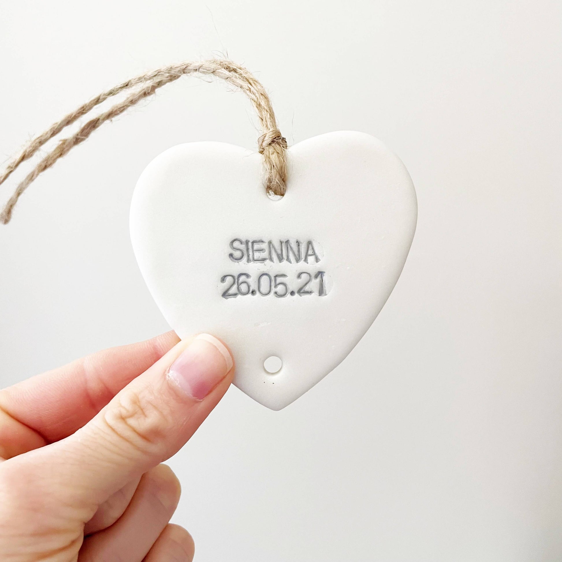 Small pearlised white polymer clay heart personalised with a name and date of birth, grandchild keepsake add on heart