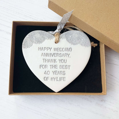 Personalised pearlised white clay hanging hearts with a grey lace edge at the top of the heart, the heart is personalised with HAPPY WEDDING ANNIVERSARY, THANK YOU FOR THE BEST 40 YEARS OF MY LIFE