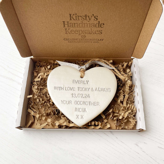 Personalised Christening baptism gift, pearlised white clay hanging heart, the heart is personalised in grey with EVERLY WITH LOVE TODAY & ALWAYS 13.07.24 YOUR GODMOTHER INDIA XX