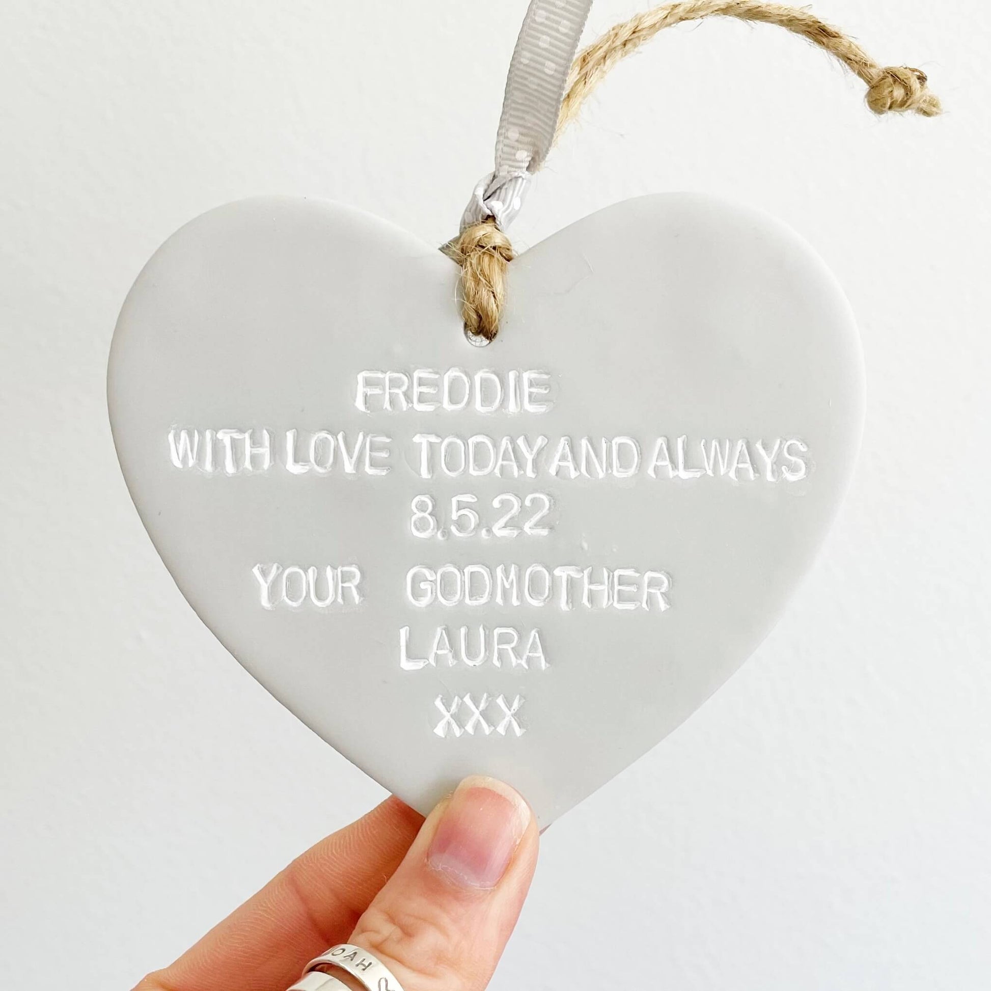 Personalised Christening baptism gift, grey clay hanging heart, the heart is personalised with FREDDIE WITH LOVE TODAY & ALWAYS 13.08.23 YOUR GODMOTHER LAURA XXX