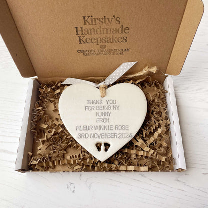Personalised Mother’s Day gift, pearlised white clay hanging heart with baby feet cut out at the bottom of the heart, the heart is personalised with THANK YOU FOR BEING MY MUMMY FROM FLEUR WINNIE ROSE 3RD NOVEMBER 2024